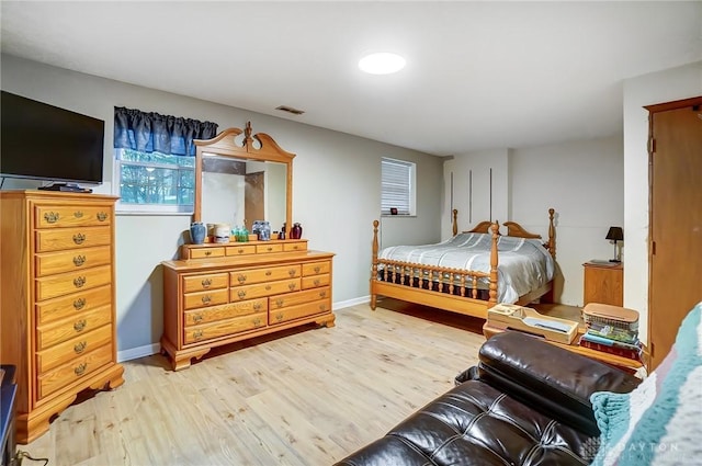 bedroom with wood-type flooring