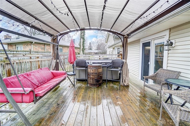 wooden deck featuring a pergola