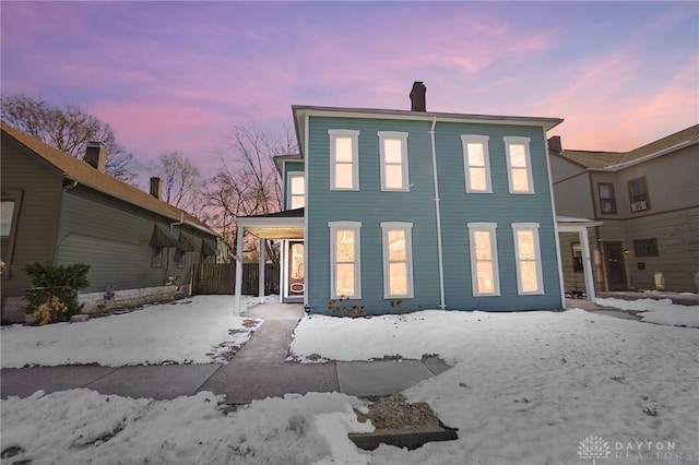 view of snow covered house