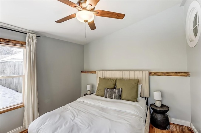 bedroom with hardwood / wood-style flooring and ceiling fan