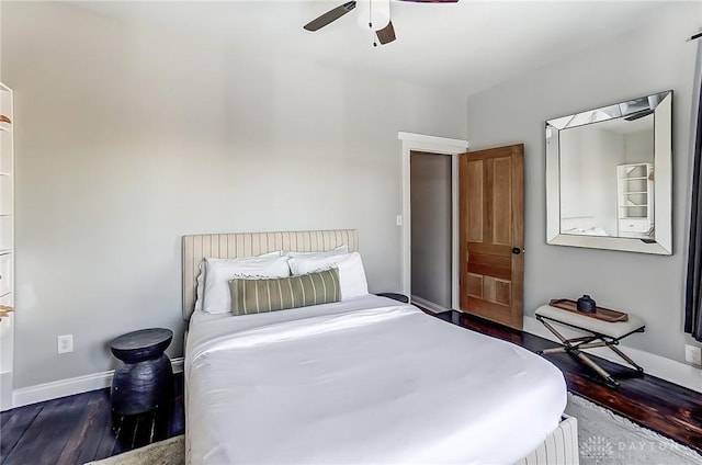 bedroom featuring ceiling fan and dark hardwood / wood-style flooring