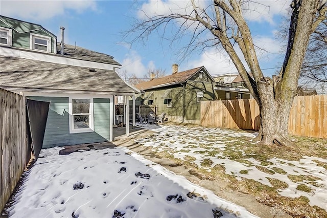 view of yard covered in snow