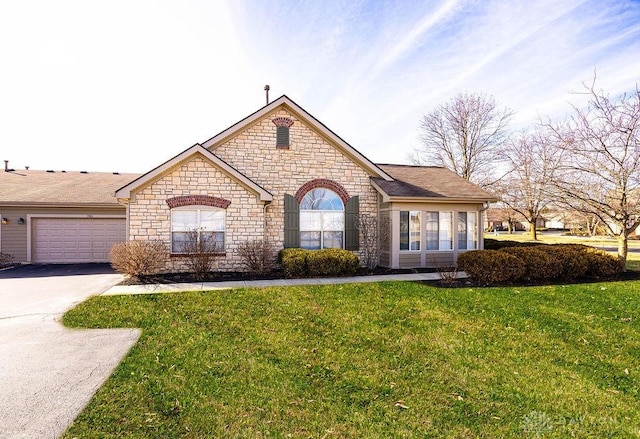 ranch-style house featuring a garage and a front yard