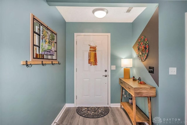 foyer featuring hardwood / wood-style floors