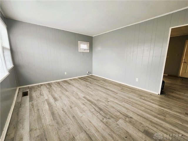 spare room featuring light hardwood / wood-style floors