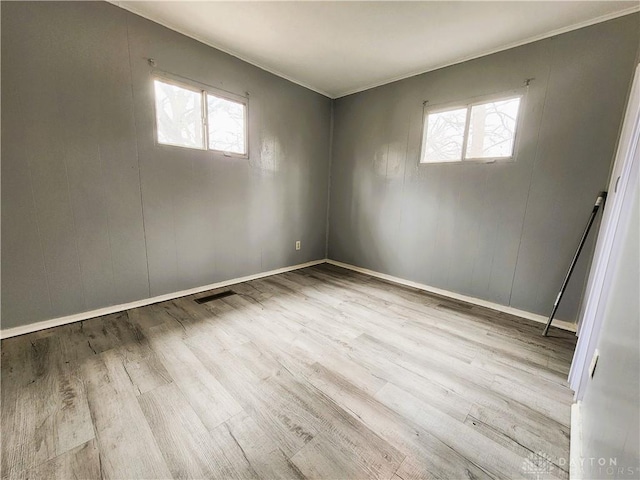 unfurnished room featuring light hardwood / wood-style flooring