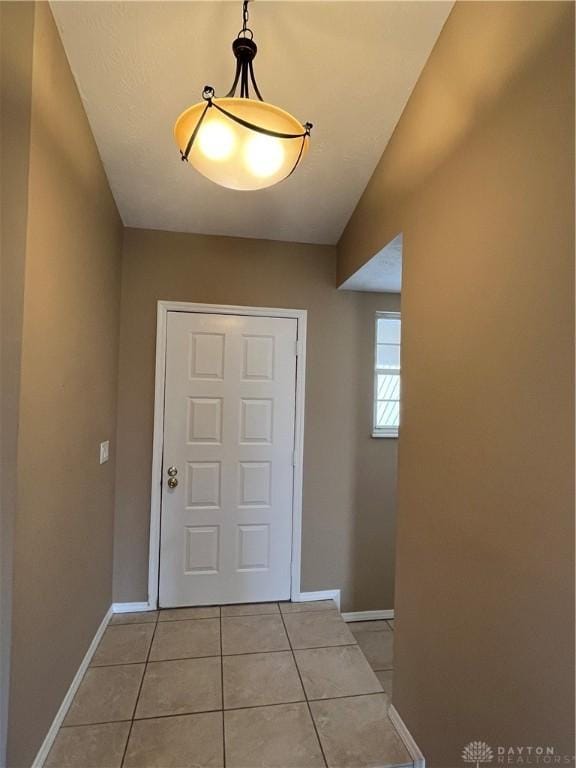 entryway featuring light tile patterned floors