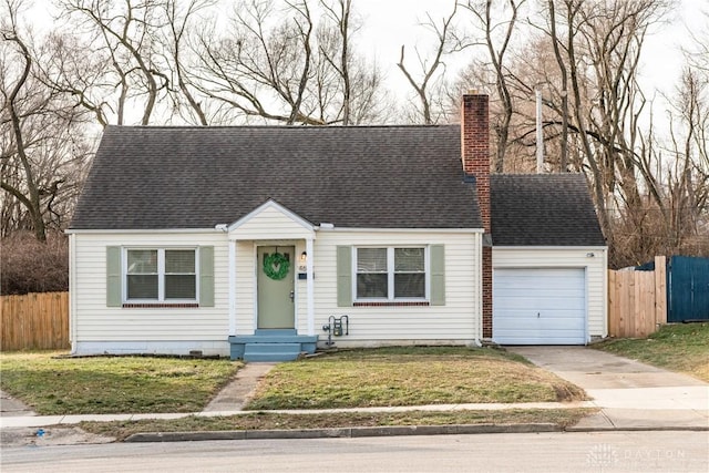 view of front of house featuring a garage and a front lawn