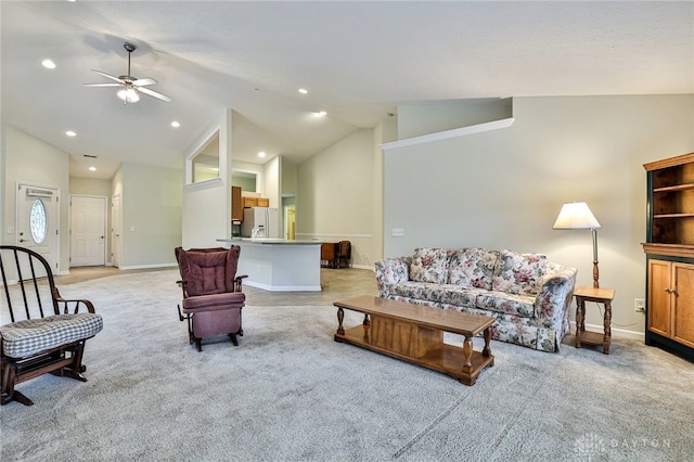 carpeted living room featuring high vaulted ceiling and ceiling fan