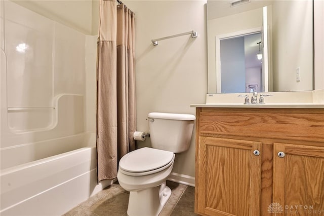 full bathroom with tile patterned floors, toilet, shower / tub combo, and vanity