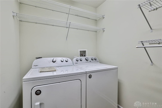 laundry room with separate washer and dryer