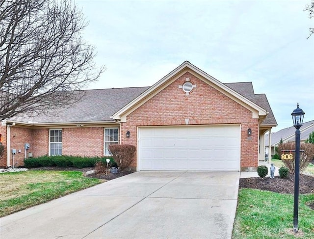 view of front of home featuring a garage and a front lawn