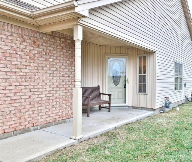 entrance to property with a patio area