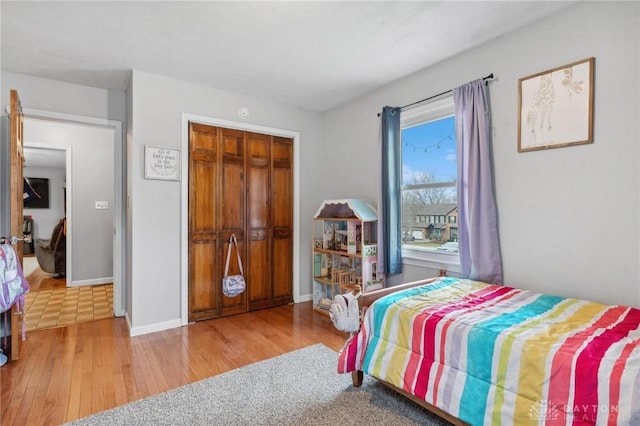 bedroom with a closet and light wood-type flooring