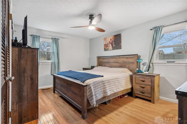 bedroom with wood-type flooring and ceiling fan