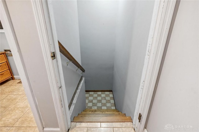 stairway with tile patterned flooring