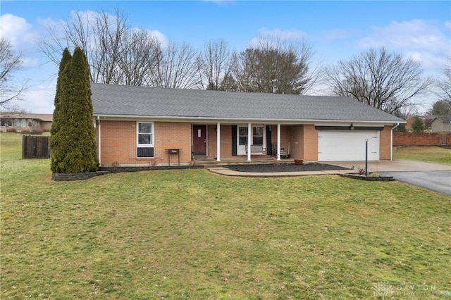 ranch-style home with a garage and a front lawn