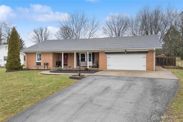 single story home with a garage and a front yard