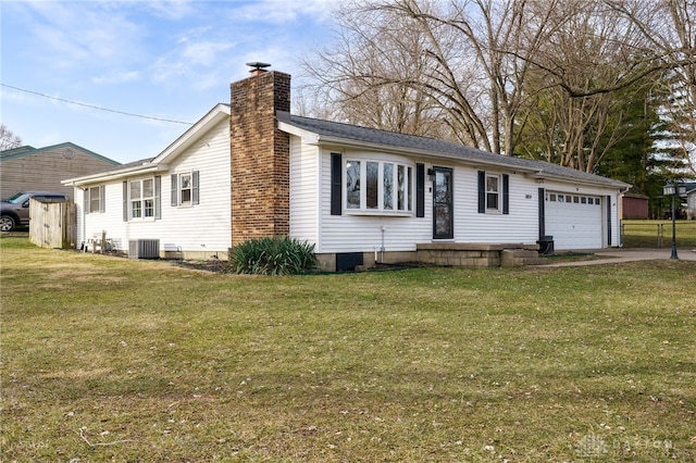 ranch-style home with central AC, a garage, and a front lawn