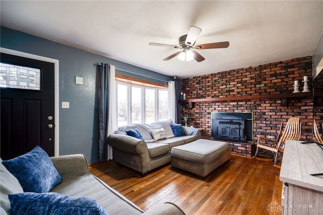 living room with wood-type flooring and ceiling fan