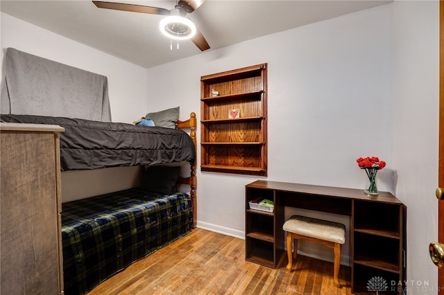 bedroom with ceiling fan and light hardwood / wood-style floors