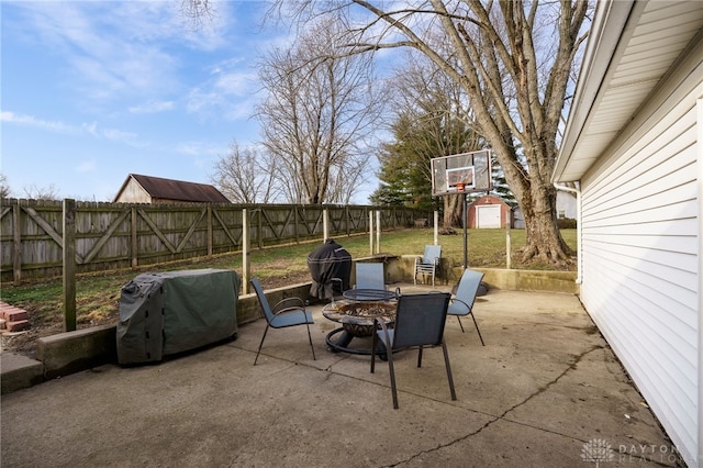 view of patio featuring area for grilling and an outdoor fire pit