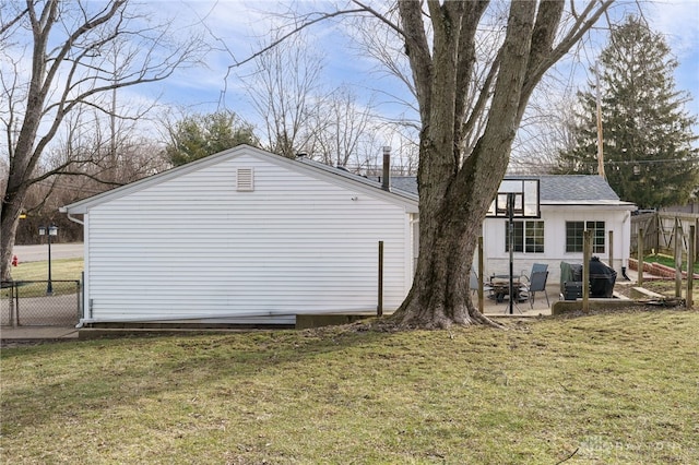 view of property exterior featuring a yard and a patio