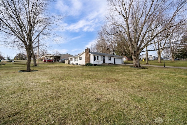 view of yard with a garage