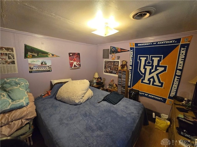 bedroom featuring crown molding