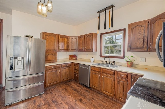 kitchen featuring sink, dark wood-type flooring, and appliances with stainless steel finishes