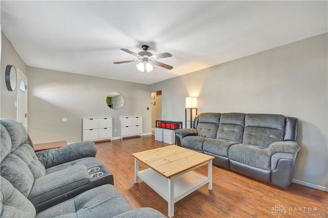 living room with hardwood / wood-style flooring and ceiling fan