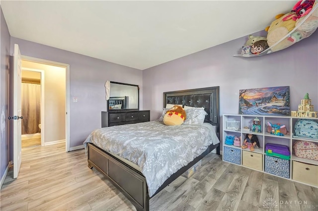 bedroom with light hardwood / wood-style flooring