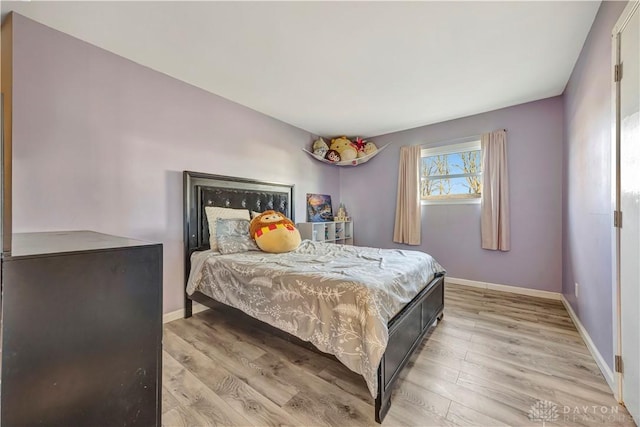 bedroom with light hardwood / wood-style flooring