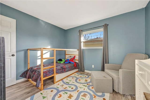 bedroom with light hardwood / wood-style floors