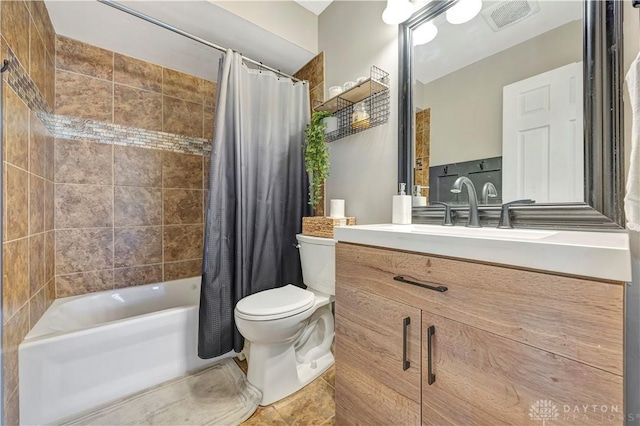 full bathroom featuring vanity, shower / bath combination with curtain, and toilet