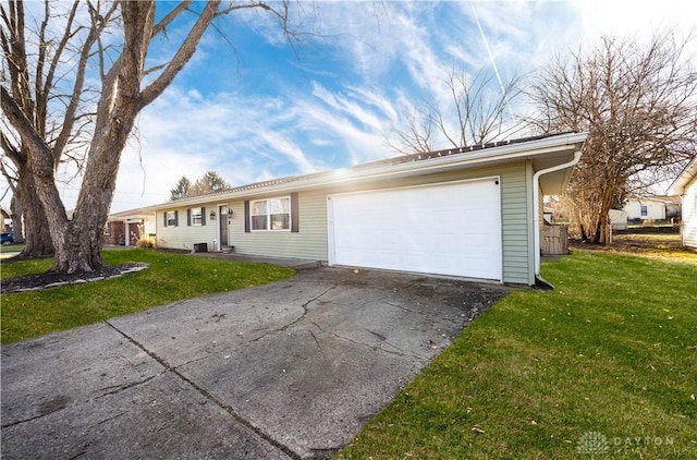 single story home featuring a garage and a front yard