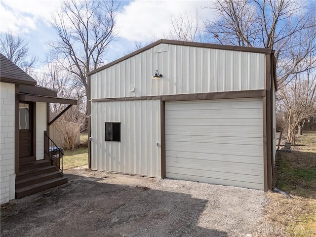 detached garage featuring driveway