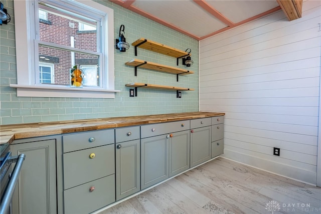 bathroom featuring tasteful backsplash and wood-type flooring