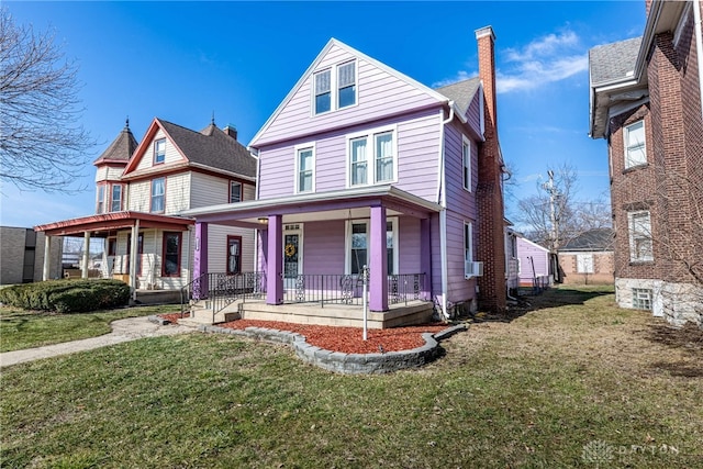 view of front of home featuring cooling unit, a porch, and a front yard