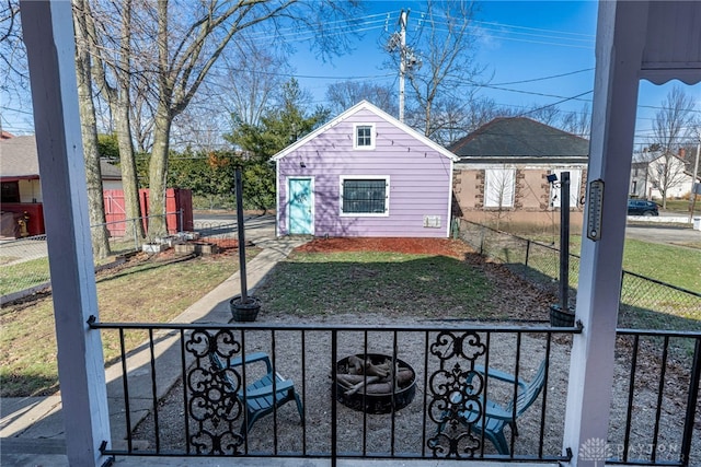 view of side of property featuring an outdoor structure and a lawn