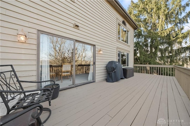 wooden terrace featuring grilling area