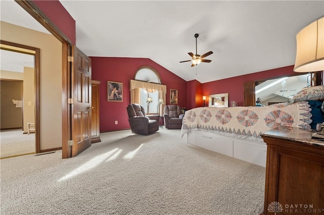 carpeted bedroom with lofted ceiling and ceiling fan