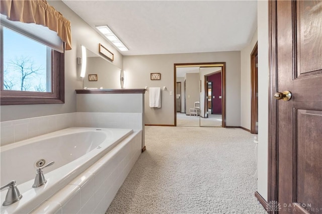 bathroom featuring a relaxing tiled tub