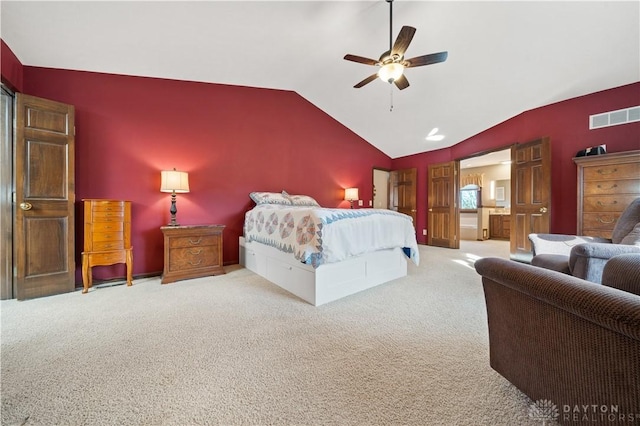 bedroom featuring lofted ceiling, light carpet, and ceiling fan