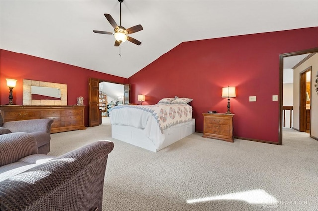 bedroom with ceiling fan, vaulted ceiling, and light carpet