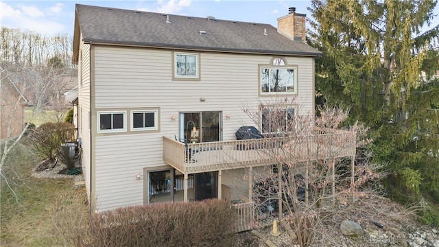 back of house featuring a deck