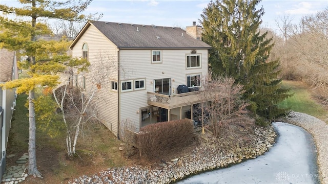 rear view of property with a deck