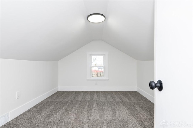 bonus room featuring lofted ceiling and carpet floors