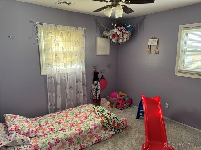 bedroom featuring ceiling fan and carpet floors