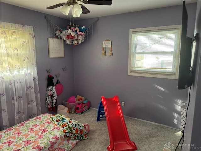 carpeted bedroom featuring ceiling fan